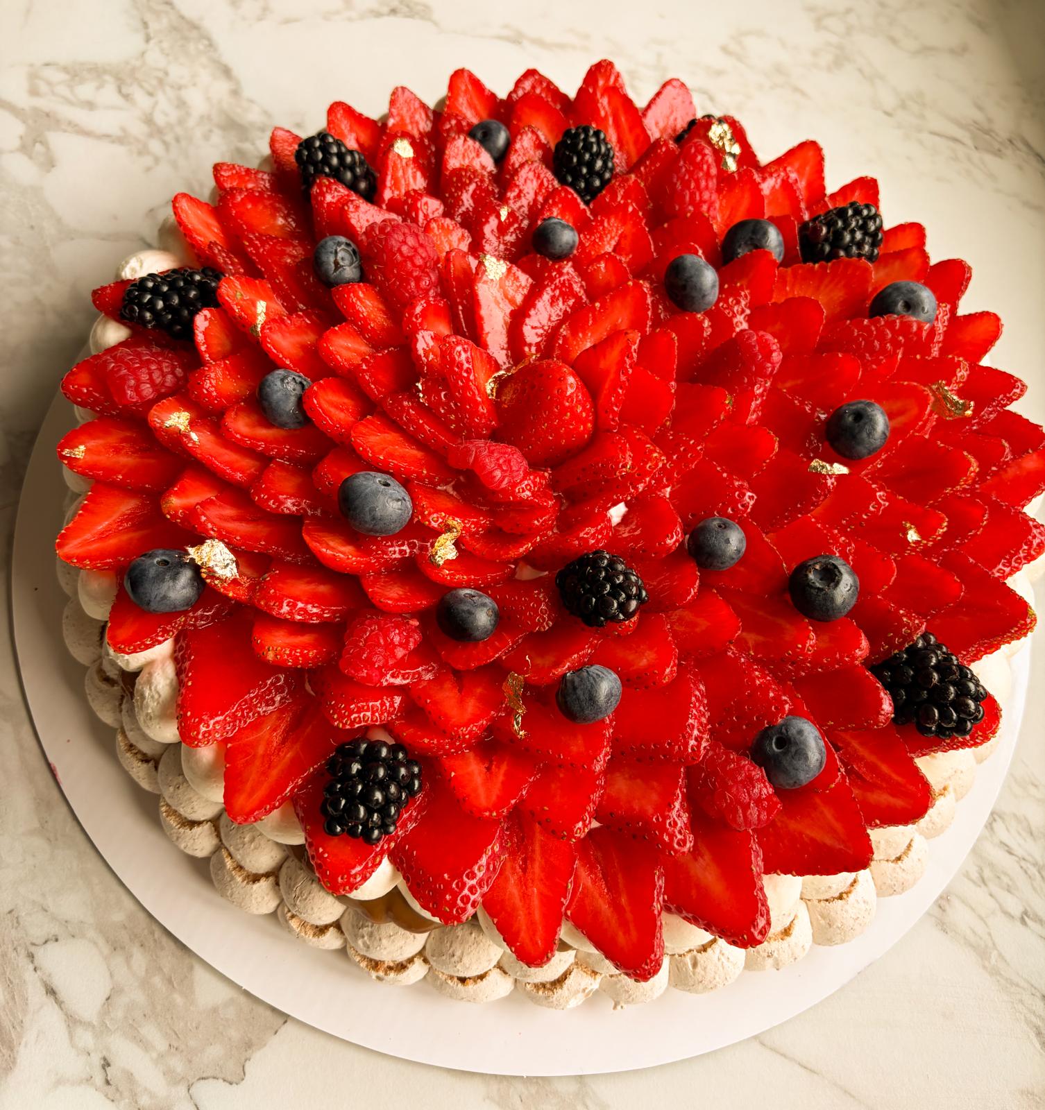 Mixed Berries Pavlova — A vibrant celebration of seasonal berries atop our signature meringue base. Laye